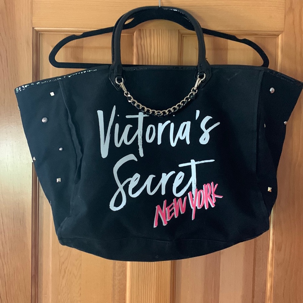 Victoria’s Secret black tote bag with metal stud detail and chain accent